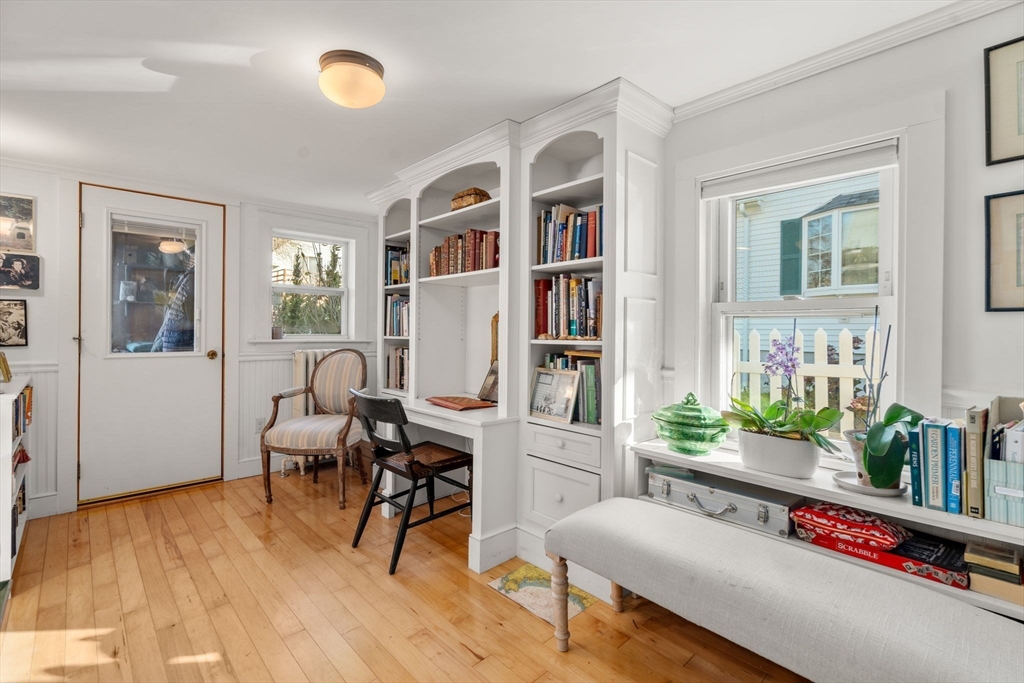 20 Haskell Street Gloucester, MA 01930 - Photo 10 of 27 a living room with furniture and a book shelf