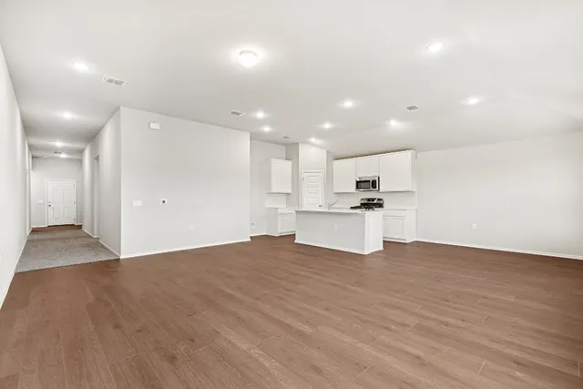 a view of kitchen with wooden floor