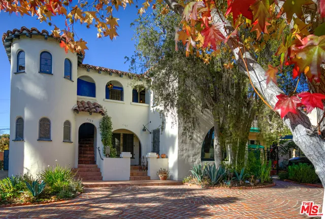 a front view of a house with yard