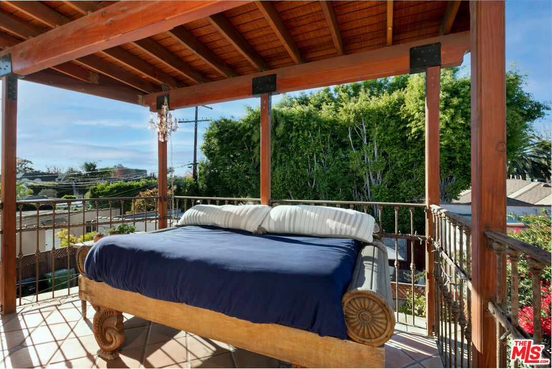1169 Hi Point Street Los Angeles, CA 90035 - Photo 15 of 27 a view of balcony with couch and chairs