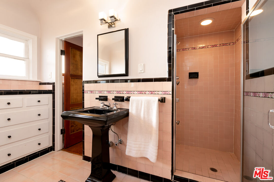 1169 Hi Point Street Los Angeles, CA 90035 - Photo 23 of 27 a kitchen with a refrigerator and a stove