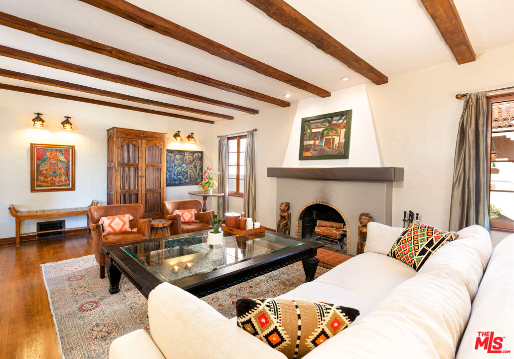 1169 Hi Point Street Los Angeles, CA 90035 - Photo 5 of 27 a living room with furniture and a fireplace