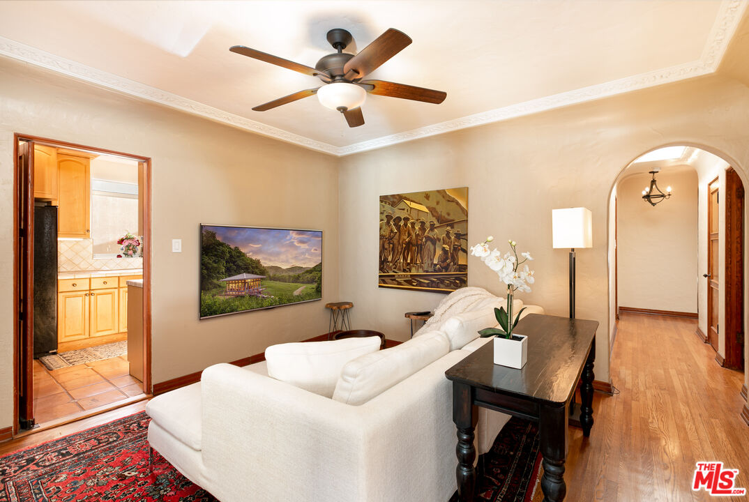 1169 Hi Point Street Los Angeles, CA 90035 - Photo 6 of 27 a living room with furniture and a large window