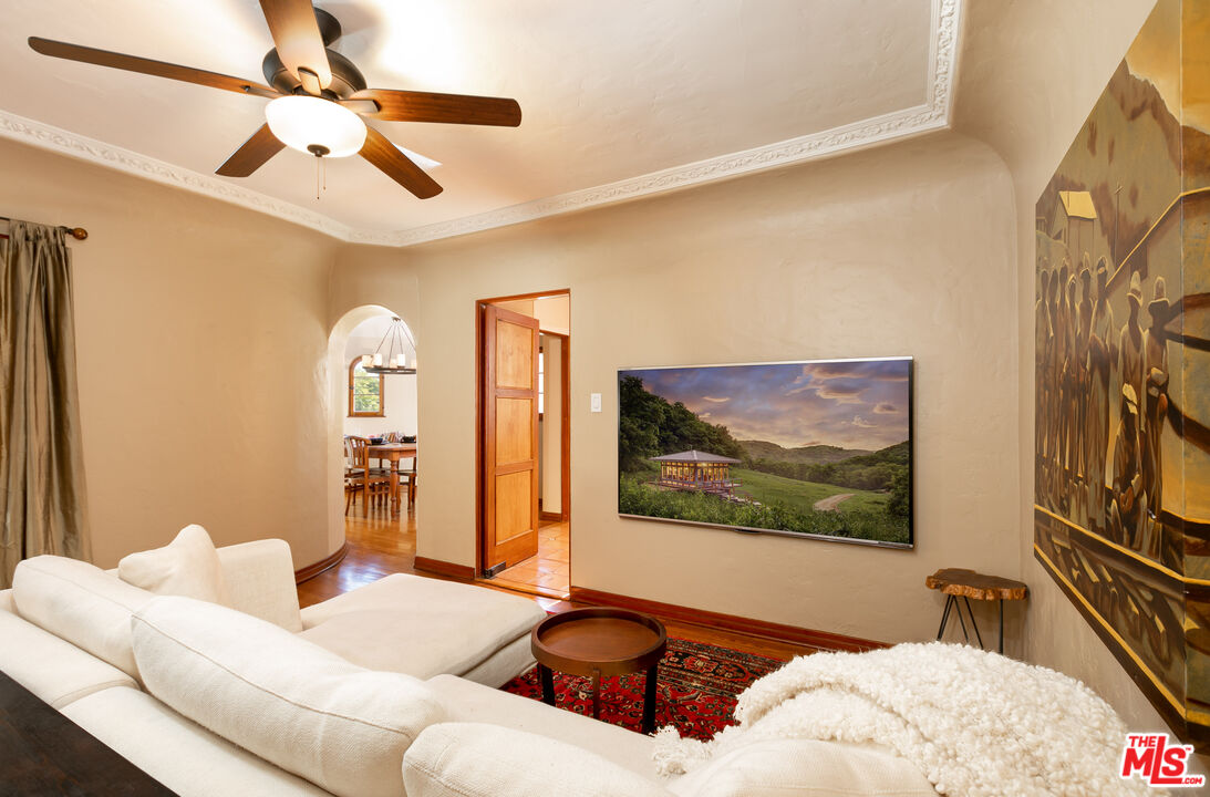 1169 Hi Point Street Los Angeles, CA 90035 - Photo 7 of 27 a living room with furniture and a flat screen tv