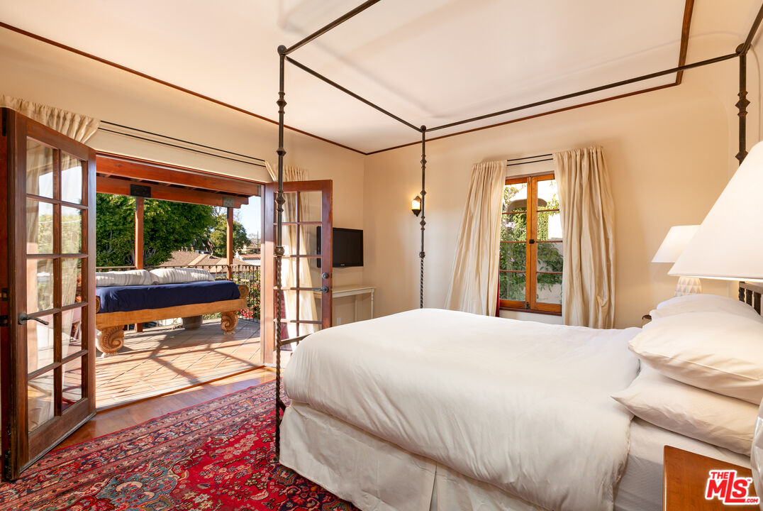 1169 Hi Point Street Los Angeles, CA 90035 - Photo 10 of 27 a bedroom with a bed window and a table