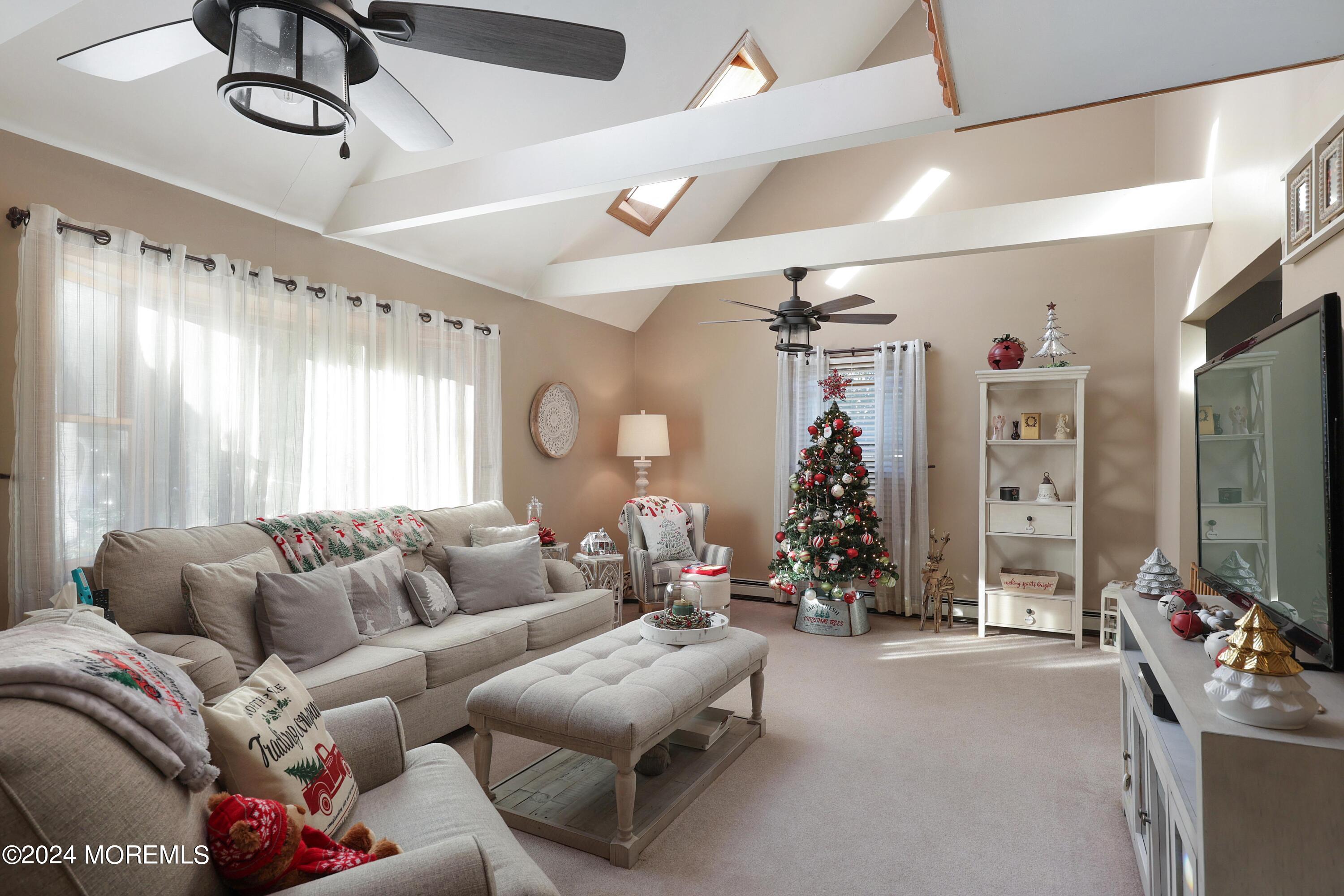 1058 Maxim Southard Road Howell, NJ 07731 - Photo 4 of 34 a living room with furniture and a flat screen tv