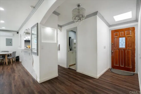 a view of a hallway view with wooden floor and staircase