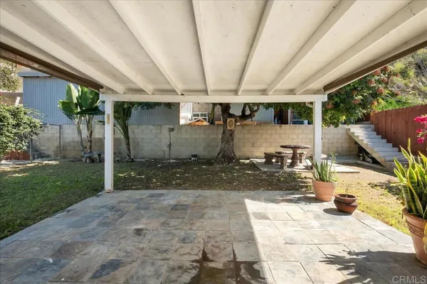 a view of a backyard with patio