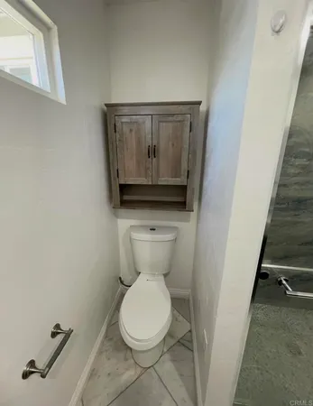 a bathroom with a toilet and a sink