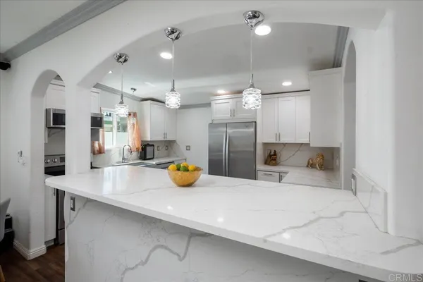 a view of a kitchen and living room view