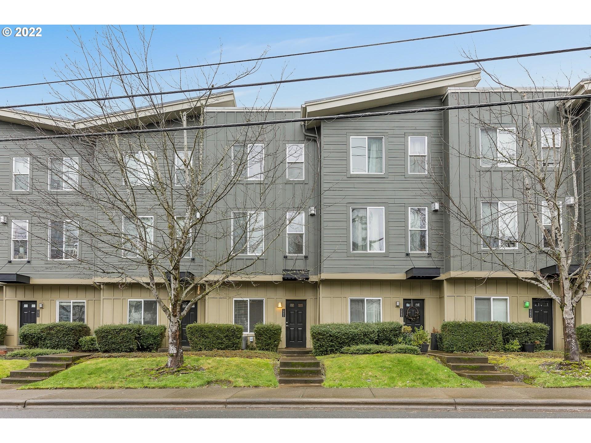 16695 Southwest Baseline Road Beaverton, OR 97006 - Photo 1 of 19 a view of a white building among the street