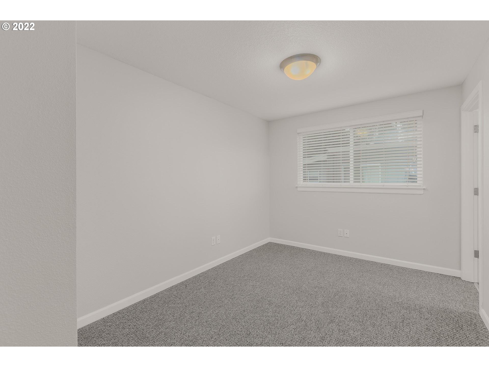 16695 Southwest Baseline Road Beaverton, OR 97006 - Photo 11 of 19 a view of an empty room with a window