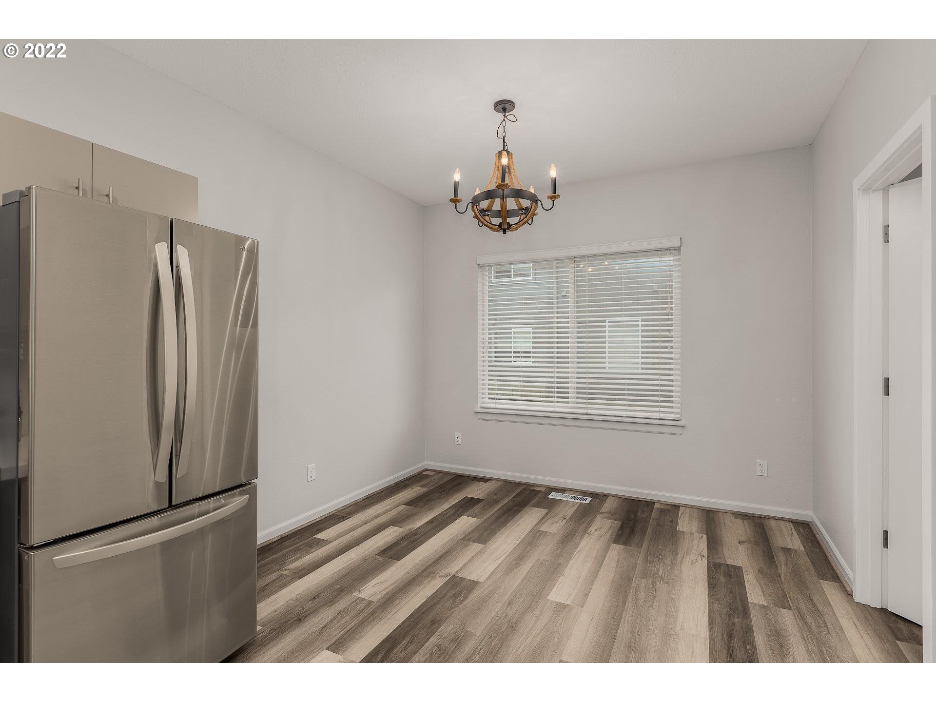 16695 Southwest Baseline Road Beaverton, OR 97006 - Photo 5 of 19 a view of an empty room with a window