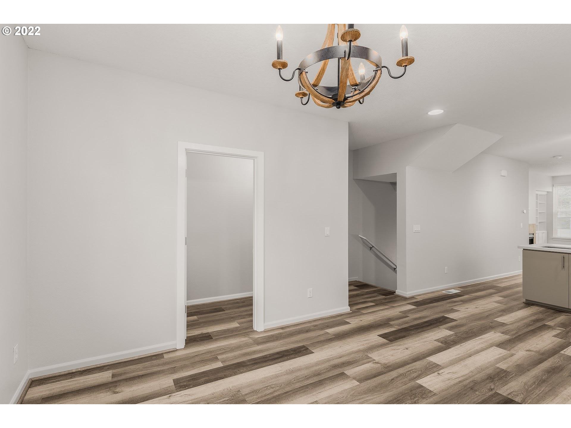 16695 Southwest Baseline Road Beaverton, OR 97006 - Photo 7 of 19 a view of a livingroom with wooden floor