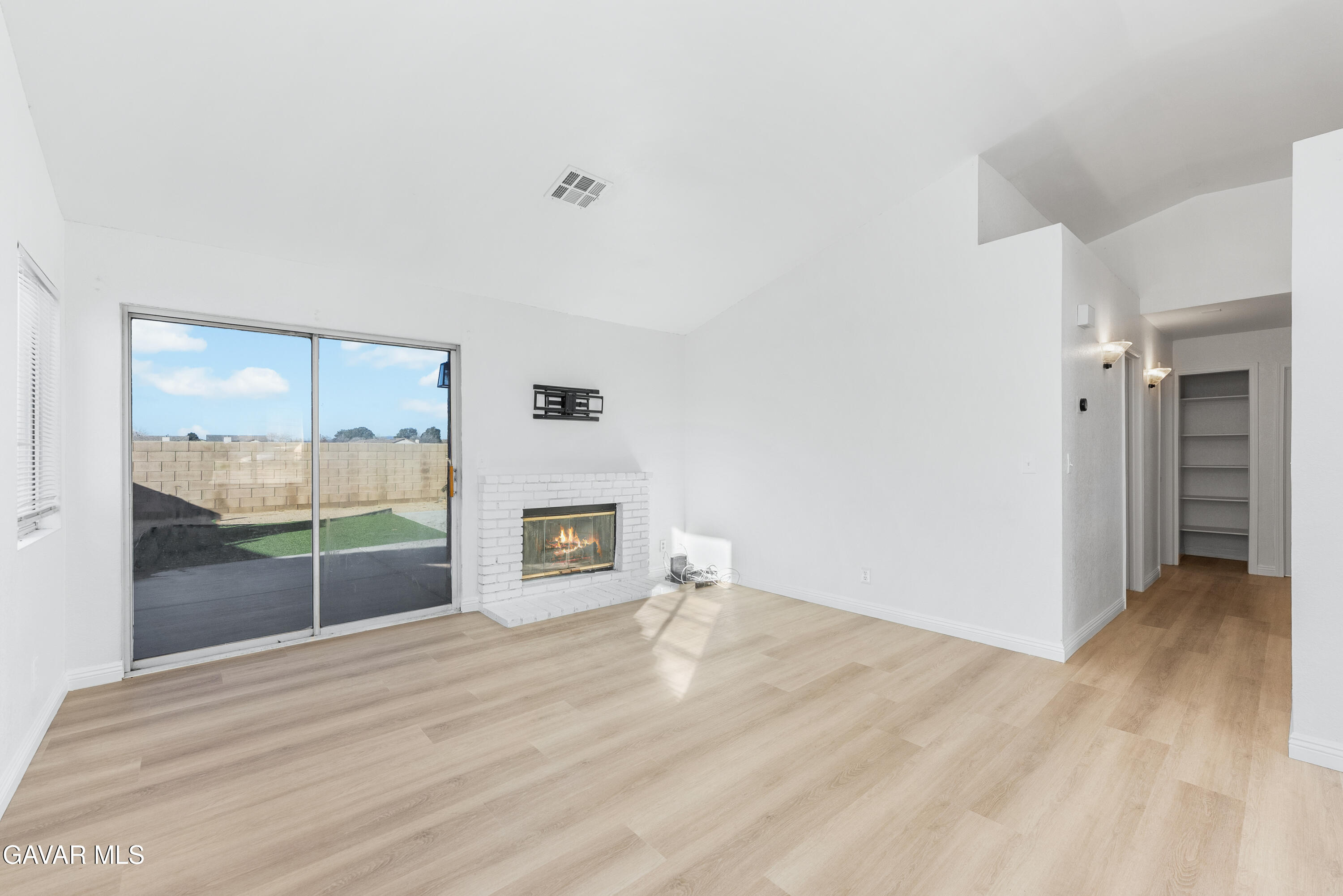 3209 Titcher Lane Rosamond, CA 93560 - Photo 13 of 36 a view of a room with wooden floor and window