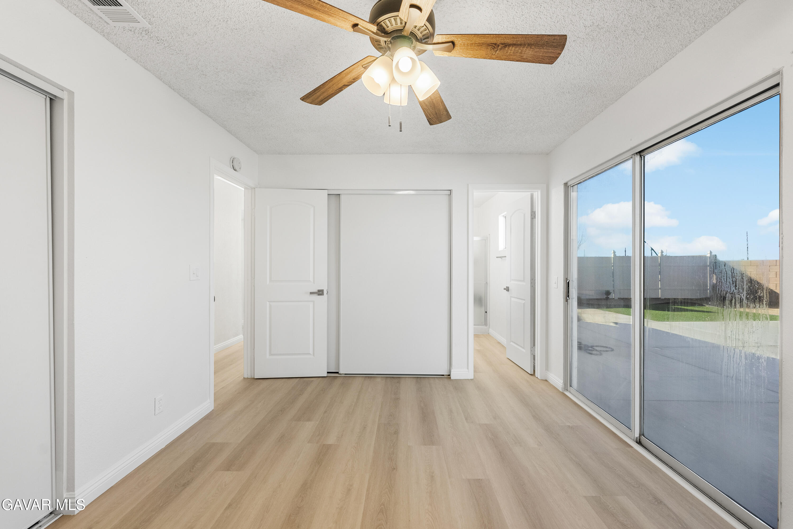 3209 Titcher Lane Rosamond, CA 93560 - Photo 24 of 36 wooden floor in an empty room with a window