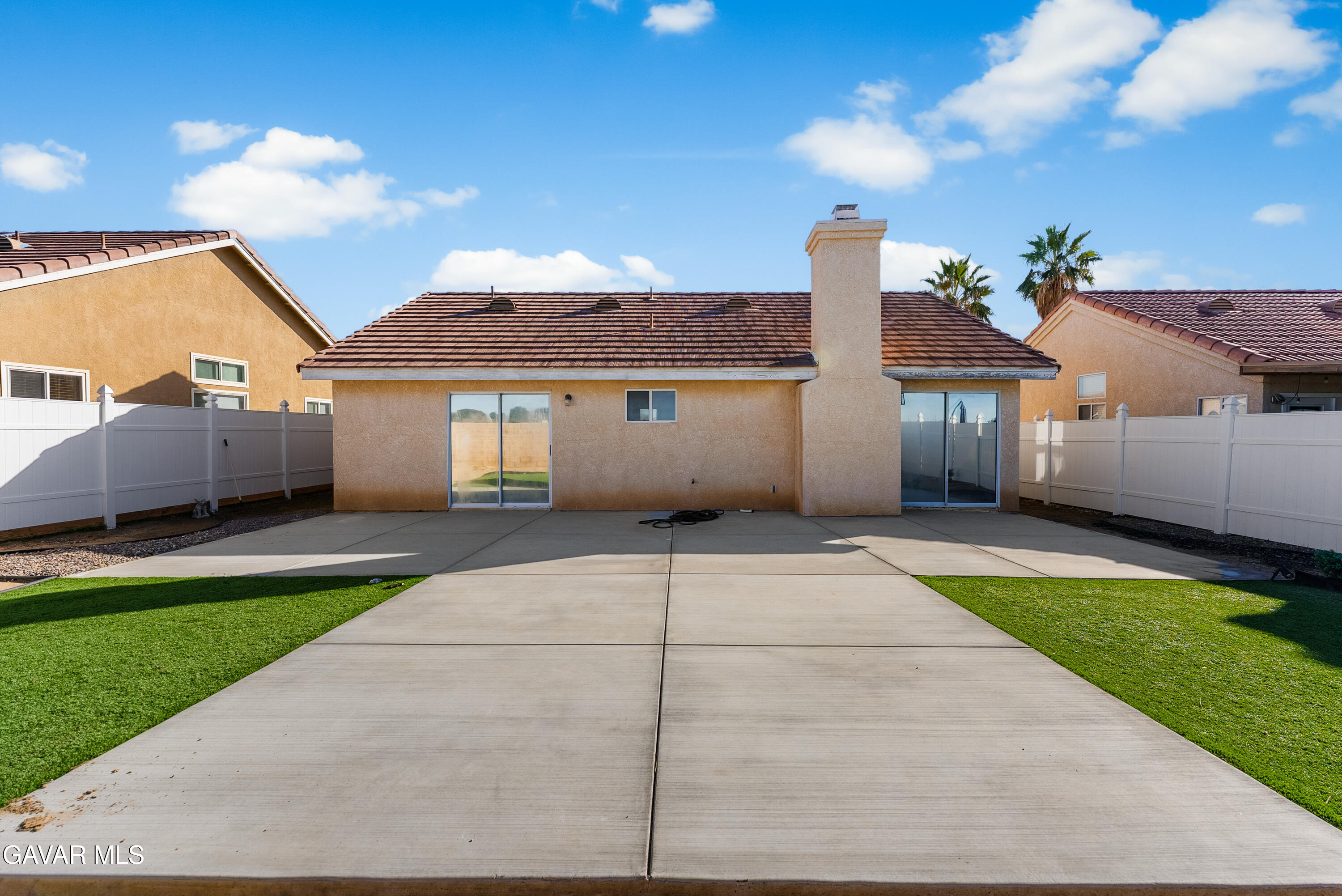 3209 Titcher Lane Rosamond, CA 93560 - Photo 33 of 36 a front view of a house with a garden and yard