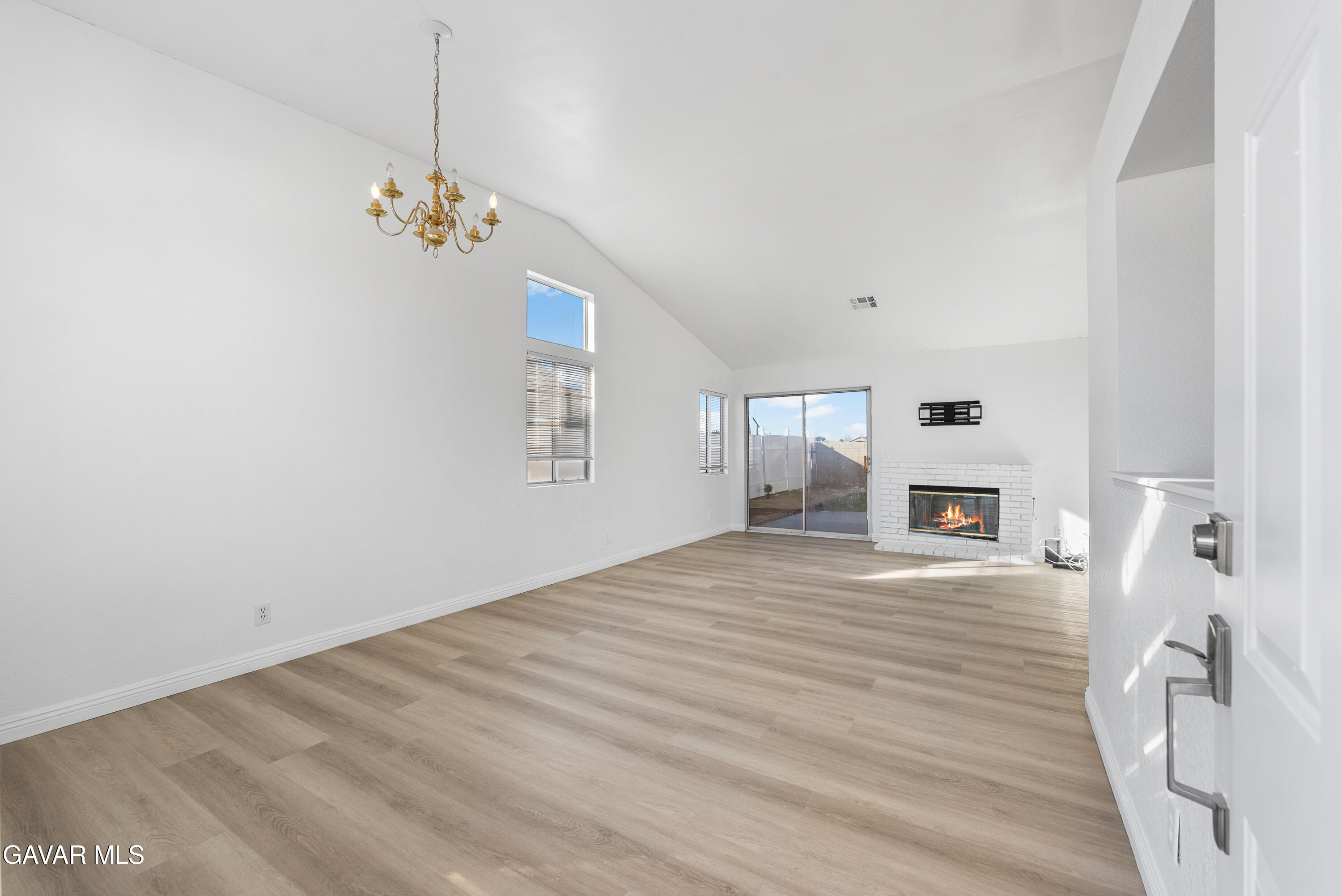 3209 Titcher Lane Rosamond, CA 93560 - Photo 7 of 36 a view of an empty room with wooden floor and a window