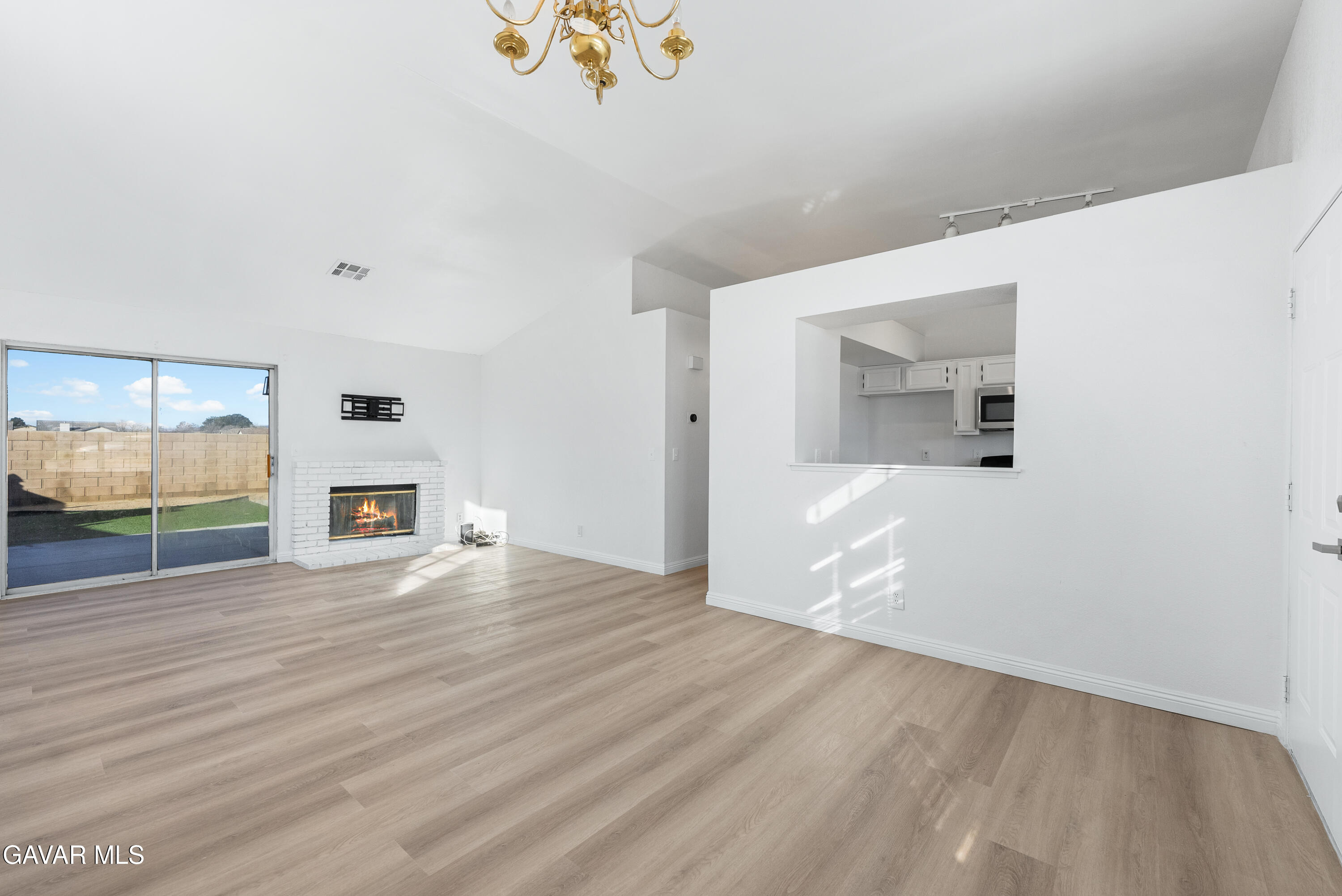 3209 Titcher Lane Rosamond, CA 93560 - Photo 10 of 36 a view of empty room with wooden floor