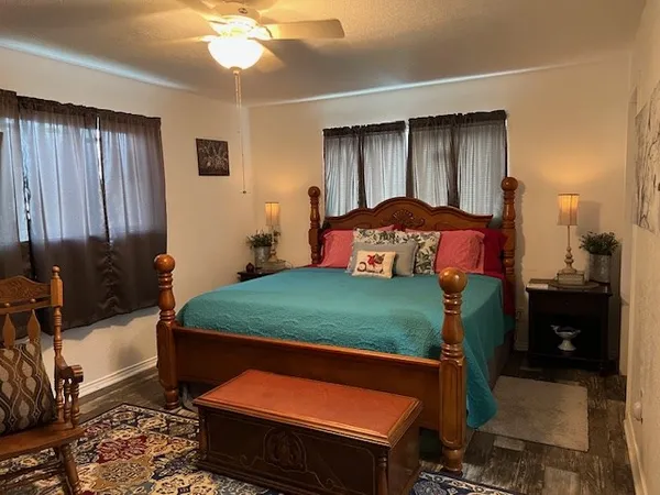 a bedroom with a bed and a mirror