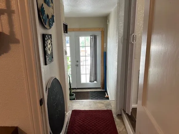a view of front door and potted plants