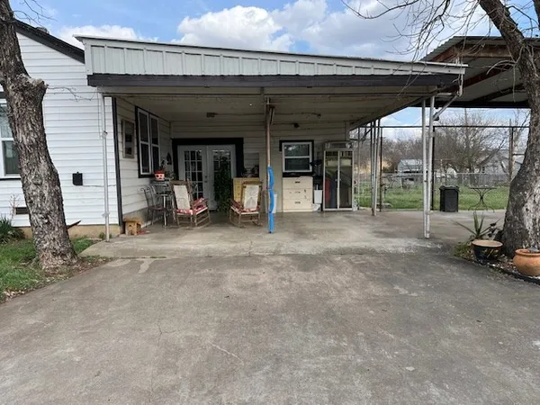 a view of a porch with seating space