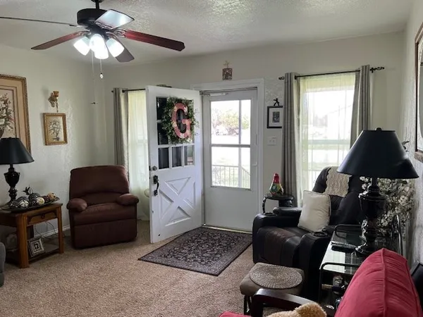 a living room with furniture and a window