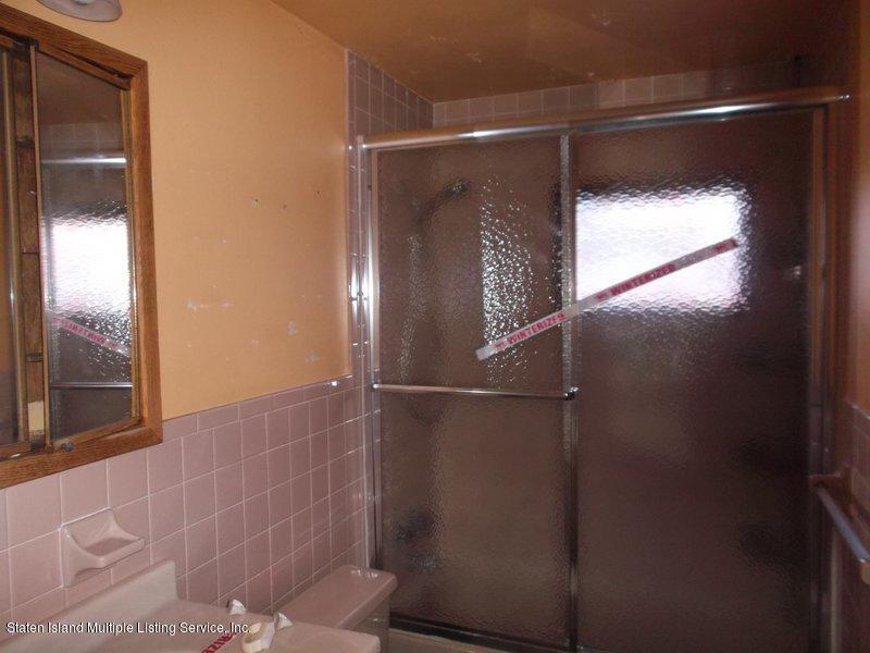 1 Sarno Street Colonia, NJ 07067 - Photo 16 of 30 a bathroom with a glass shower door