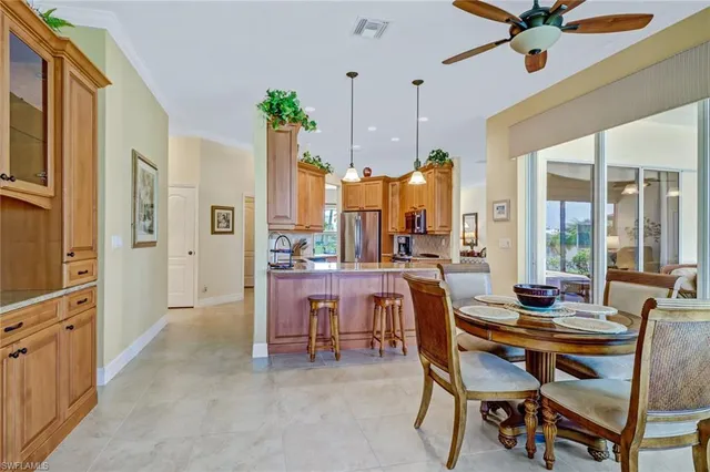 a dining room with furniture and window