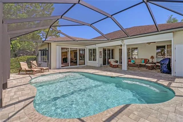 a view of a house with backyard porch and sitting area