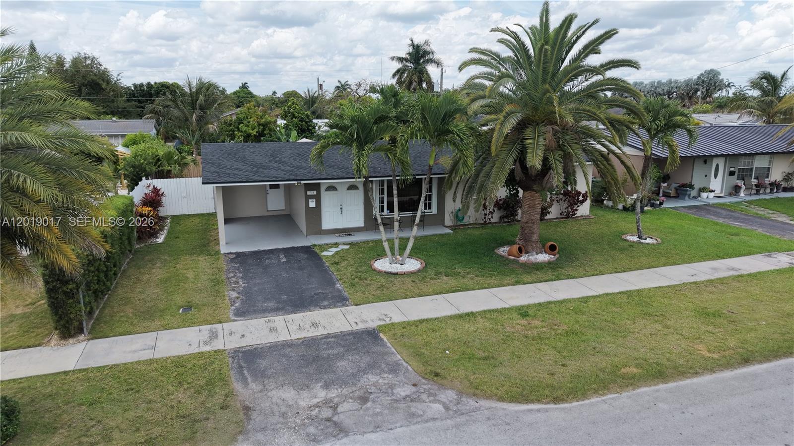 731 Northwest 17th Street Homestead, FL 33030 - Photo 21 of 29 an aerial view of a house with swimming pool and yard