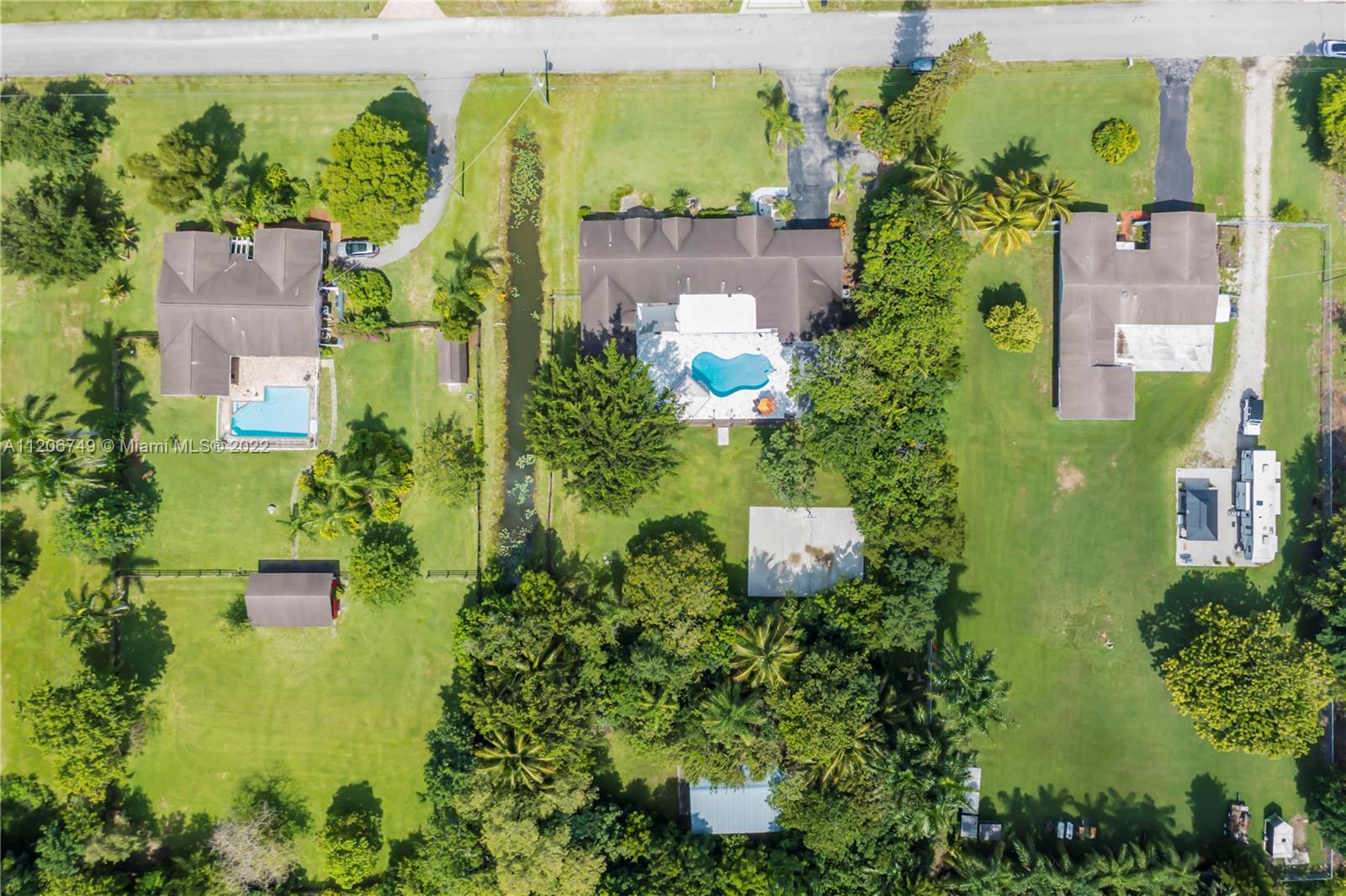 5000 Southwest 164th Terrace Southwest Ranches, FL 33331 - Photo 46 of 60 an aerial view of a house with a yard swimming pool outdoor seating and yard