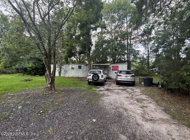 a house view with a backyard space