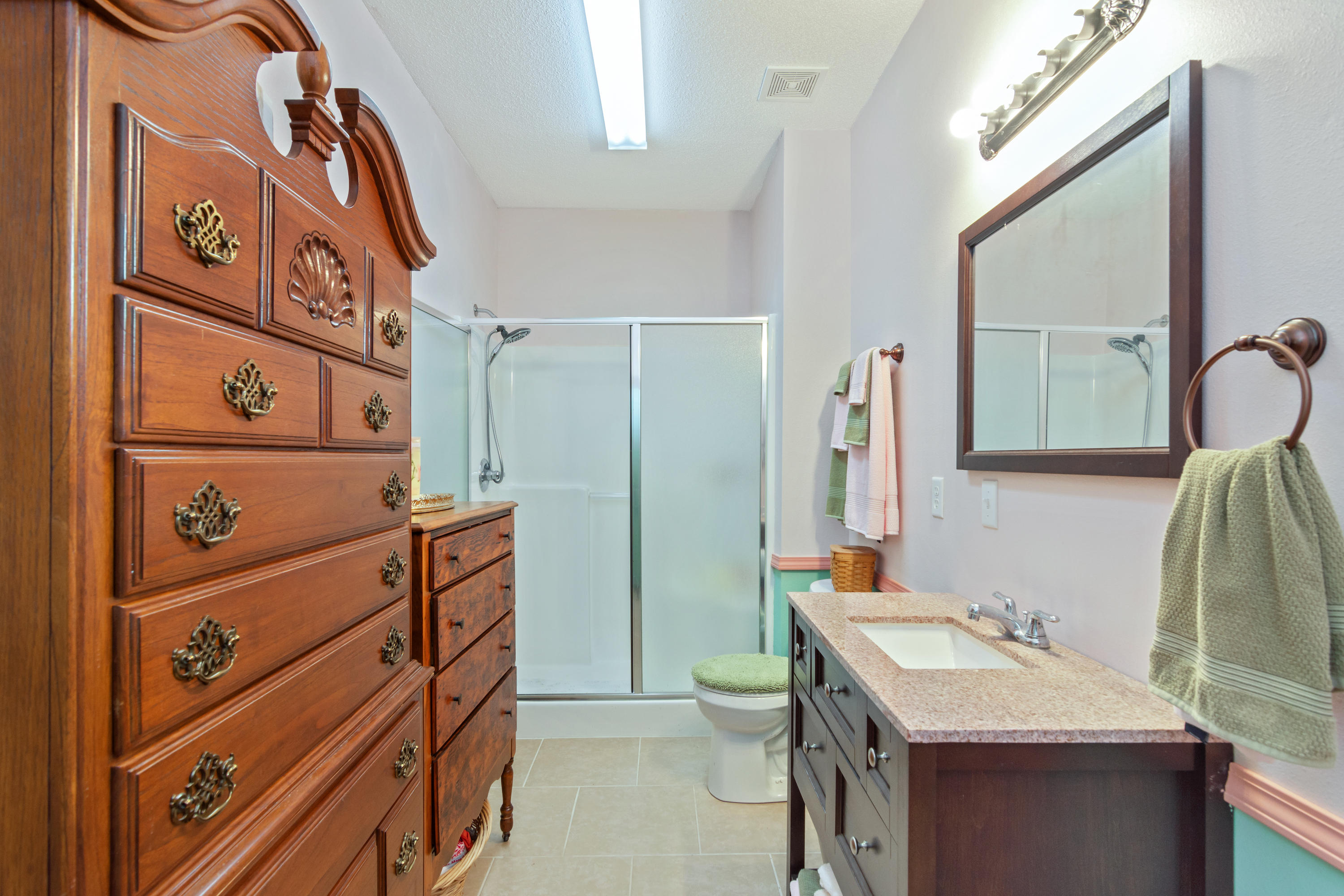 5925 Jack Stokes Road Baker, FL 32531 - Photo 15 of 15 a bathroom with a sink vanity granite and a mirror
