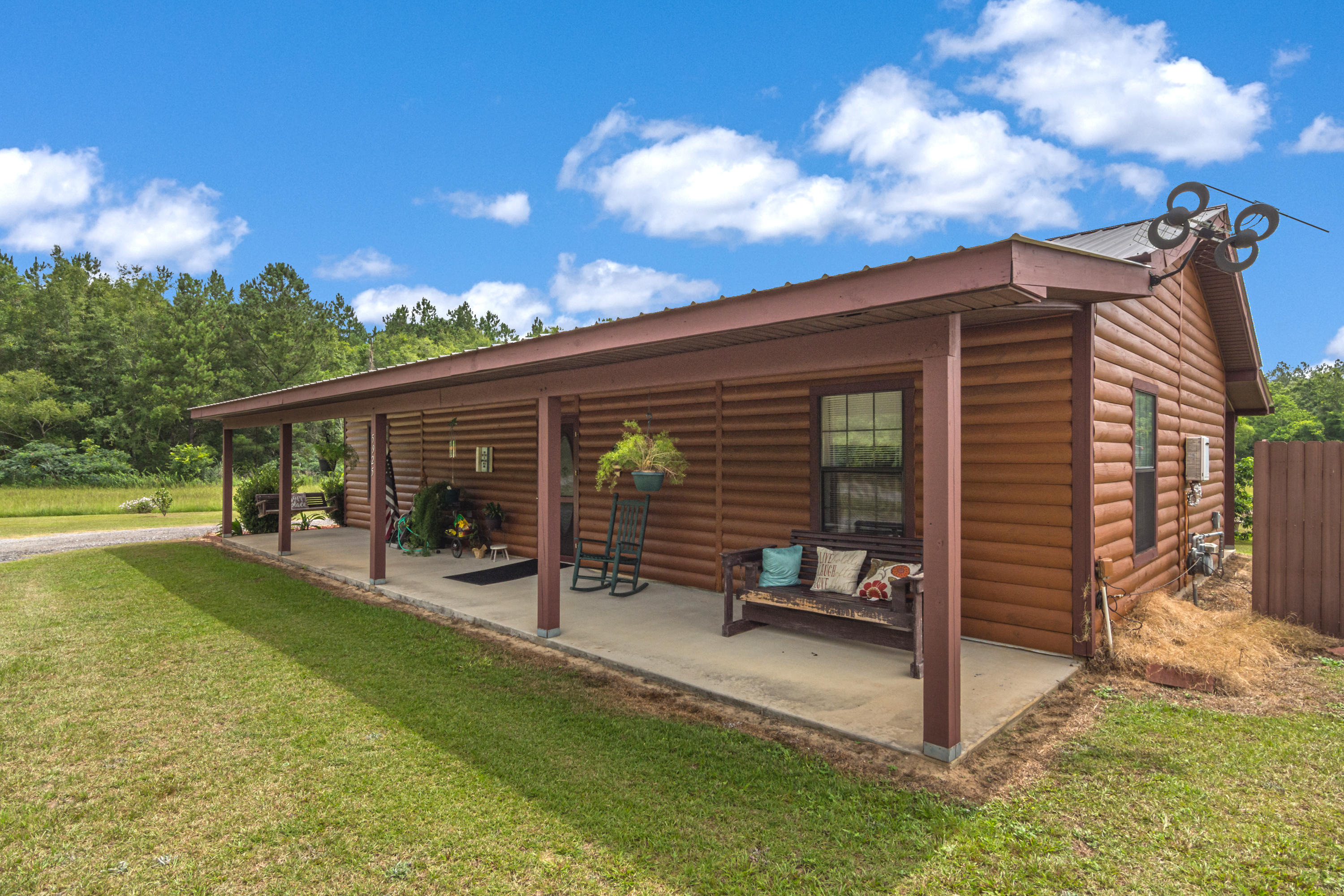 5925 Jack Stokes Road Baker, FL 32531 - Photo 3 of 15 a view of a house with backyard and porch