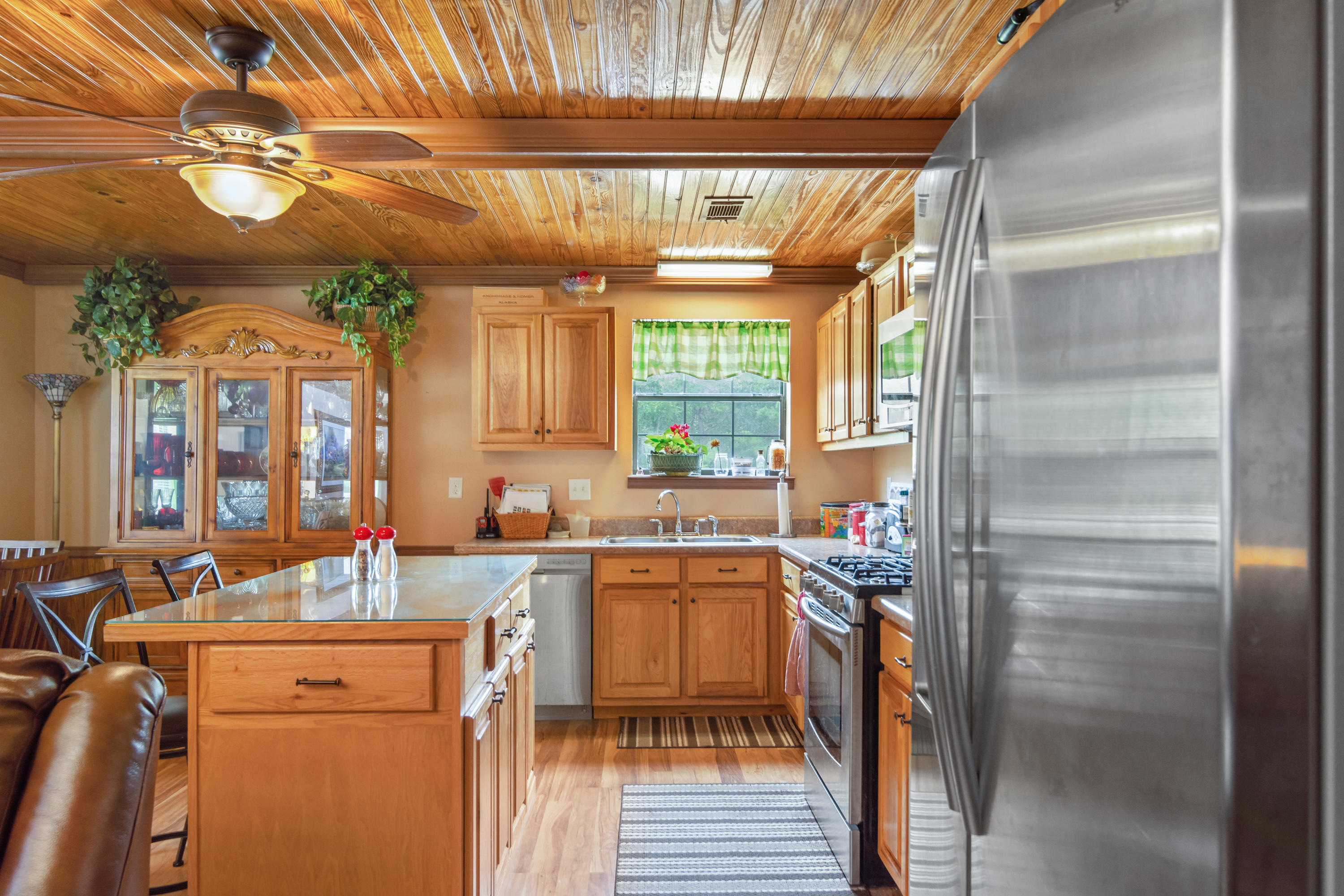 5925 Jack Stokes Road Baker, FL 32531 - Photo 6 of 15 a kitchen with lots of counter top space and stainless steel appliances