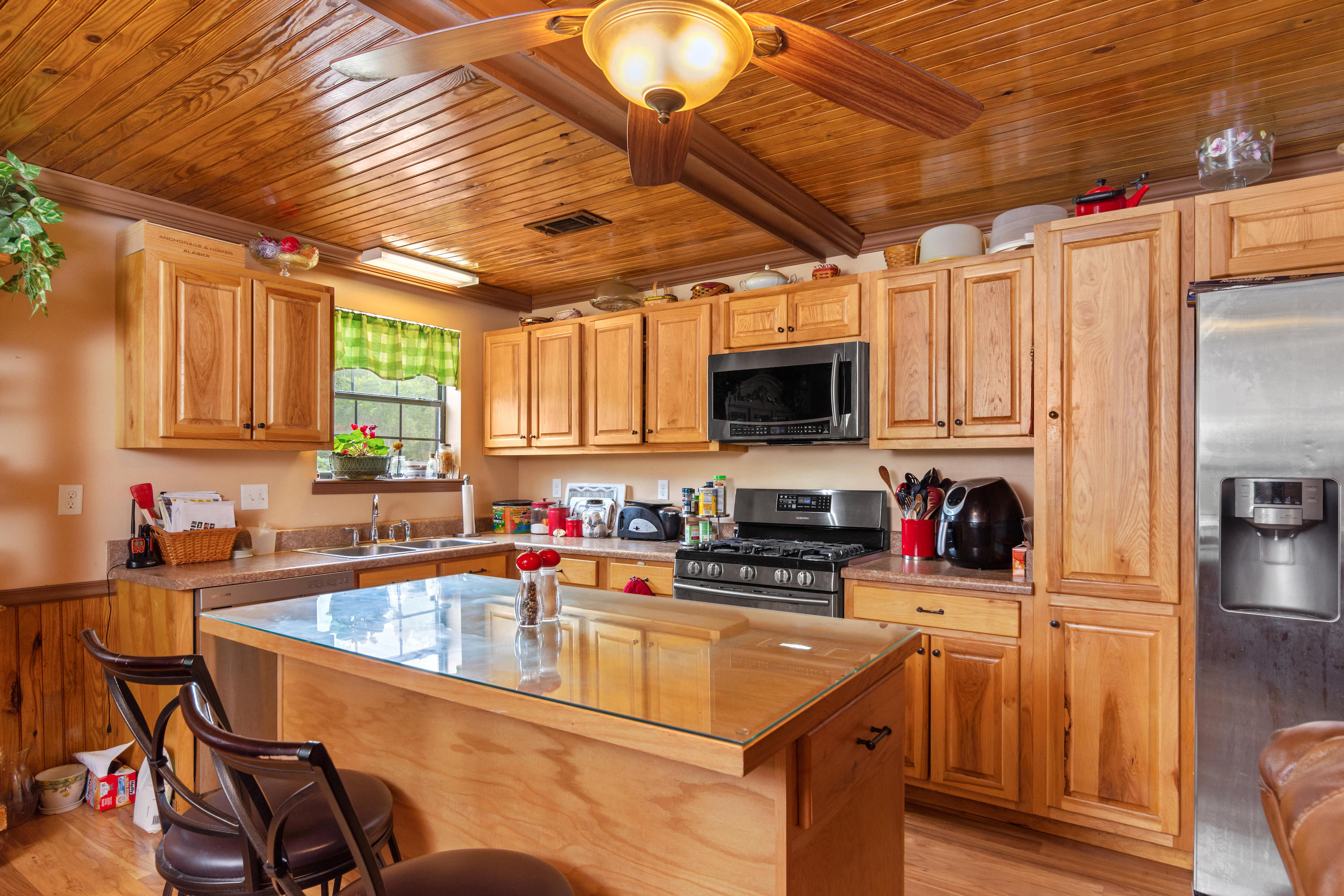 5925 Jack Stokes Road Baker, FL 32531 - Photo 7 of 15 a kitchen that has a sink cabinets counter space and stainless steel appliances