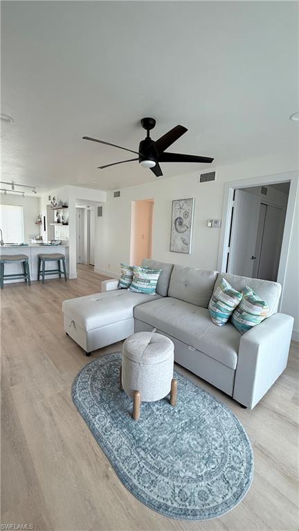 2235 San Marco Road, Unit 5204 Marco Island, FL 34145 - Photo 2 of 34 Open-concept living space with light wood-finish flooring, a contemporary black ceiling fan with five blades, and recessed lighting
