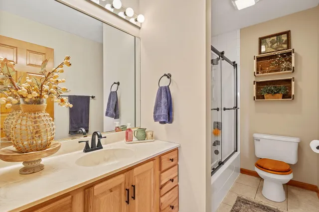 a view of a room with projector and furniture