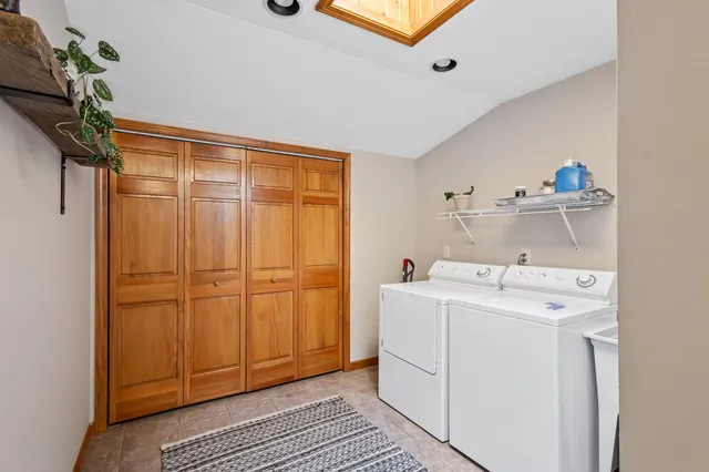 a view of a house with a yard and a porch