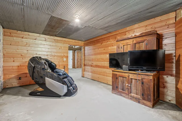 a front view of a house with a garden and plants