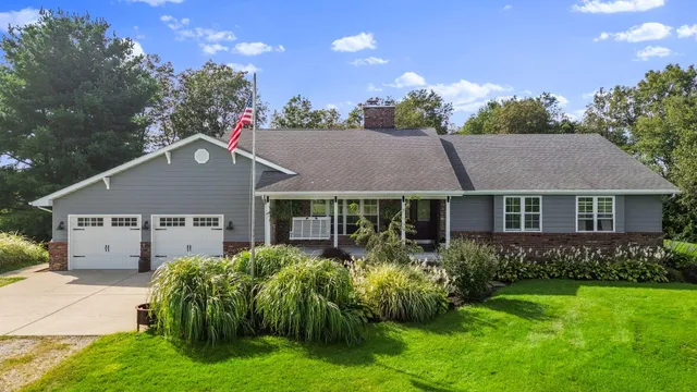 a view of a livingroom with furniture and a flat screen tv