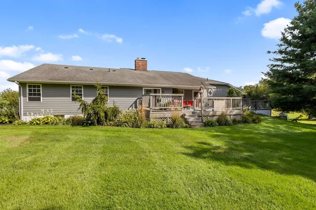 a view of a street with a big yard