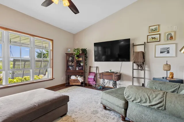 a living room with fireplace furniture and a chandelier