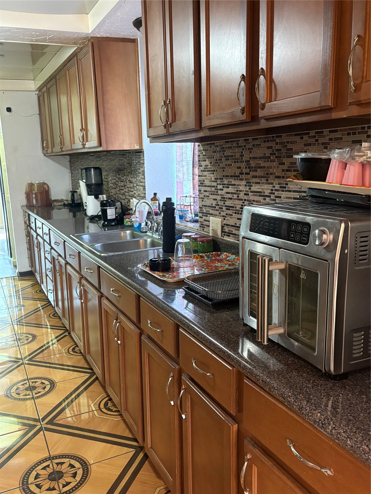 2013 Deats Road Dickinson, TX 77539 - Photo 41 of 50 a kitchen with stainless steel appliances granite countertop a sink stove and cabinets