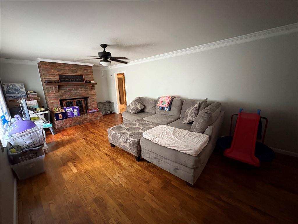 15 John Ross Drive Southwest Rome, GA 30165 - Photo 2 of 10 a living room with furniture and a fireplace