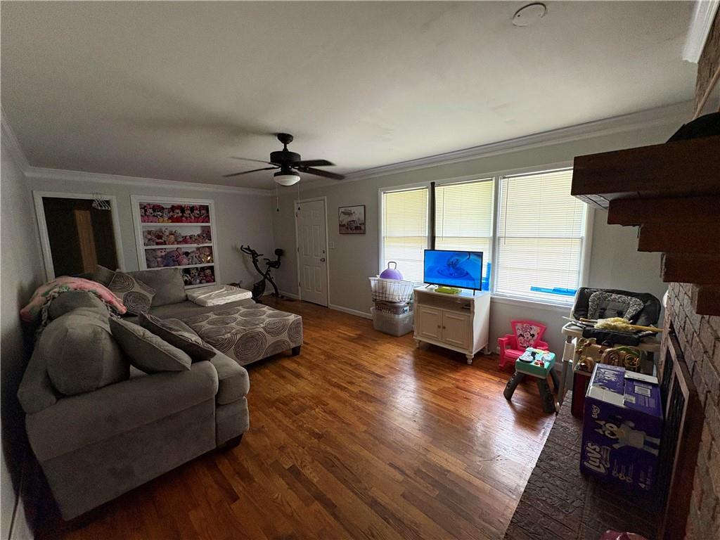 15 John Ross Drive Southwest Rome, GA 30165 - Photo 3 of 10 a living room with furniture window and a wooden floor
