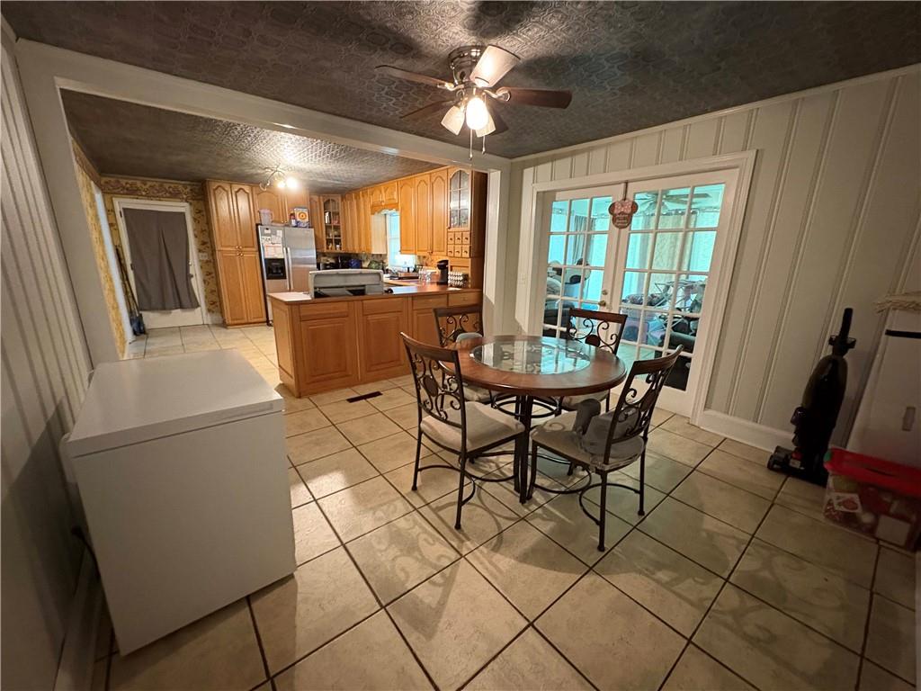 15 John Ross Drive Southwest Rome, GA 30165 - Photo 5 of 10 a dining room with furniture and a chandelier