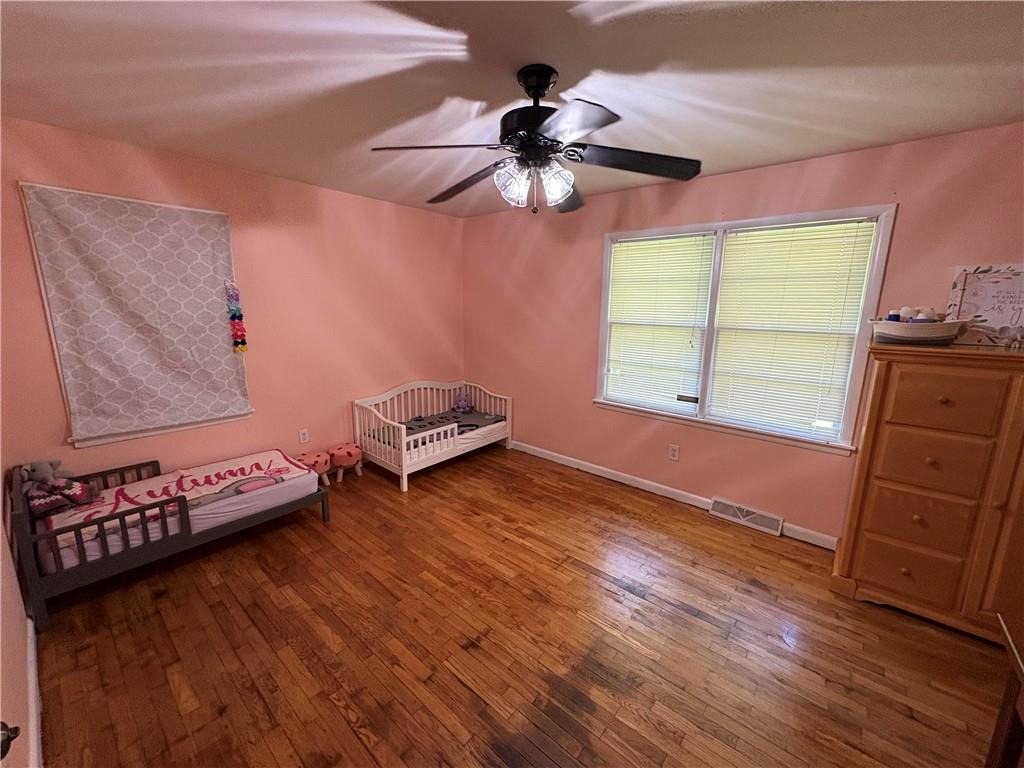 15 John Ross Drive Southwest Rome, GA 30165 - Photo 8 of 10 a bedroom with furniture and a window