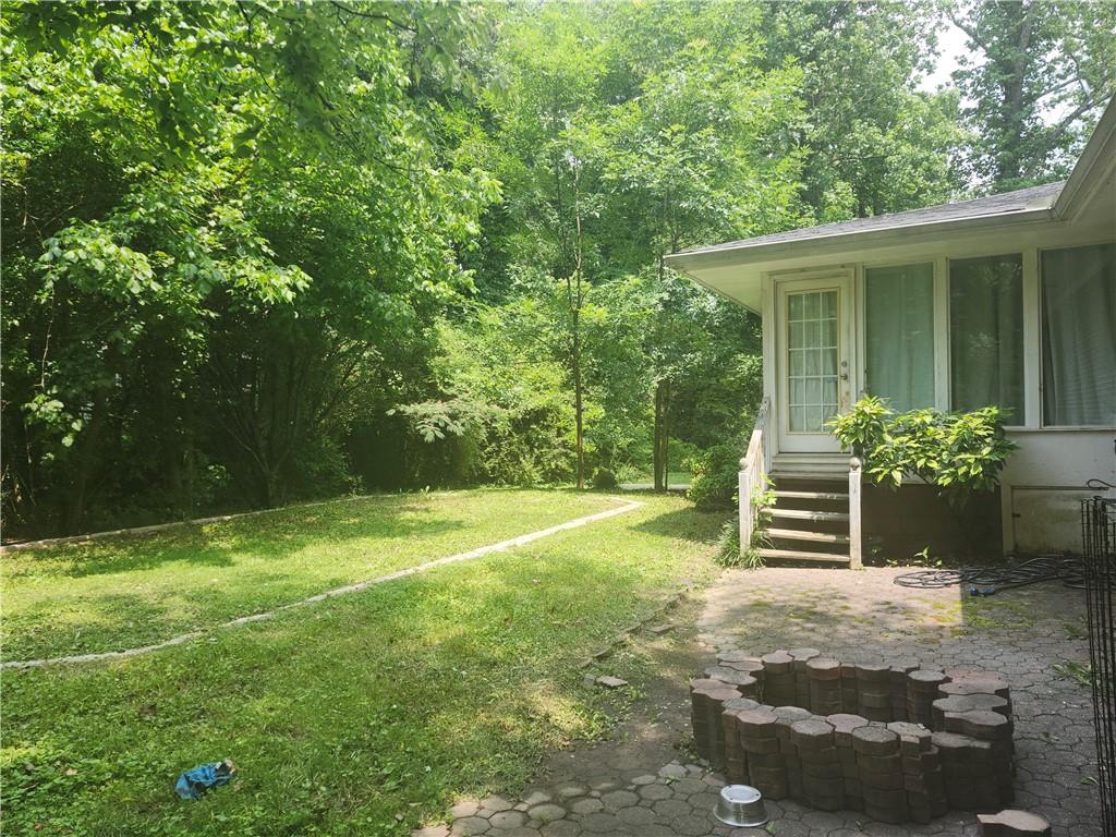 15 John Ross Drive Southwest Rome, GA 30165 - Photo 10 of 10 a backyard of a house with table and chairs